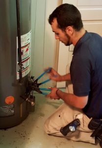 plumber working on a water heater